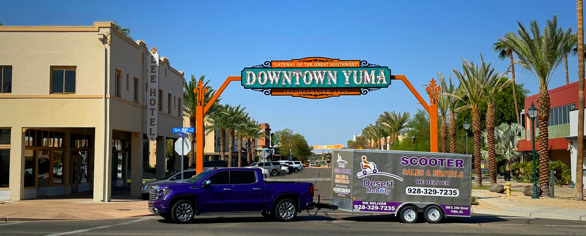 Branded Truck and Trailer in front of the Downtown Yuma sign